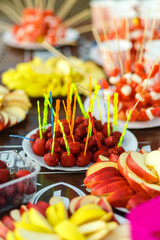 Table with colored sweet snacks. Outdoor party
