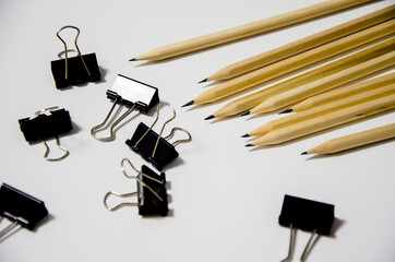 wooden pencils lie on a white background. education and business concept