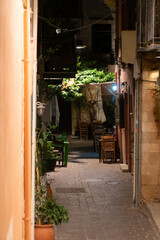 Fototapeta na wymiar Old town street at night. illumination and vivid colors, Chania, Crete