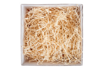 Opened gift box with decorative straw, filler, shavings. Top view, empty giftbox isolated on white, mockup for design
