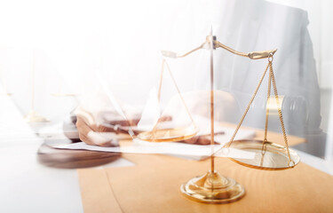 Business and lawyers discussing contract papers with brass scale on desk in office. Law, legal...