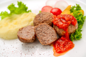 Veal meatballs with rice and tomato sauce