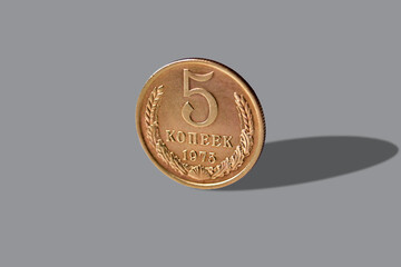 Old coin of five soviet (kopecks) penny isolated over white background with reflection