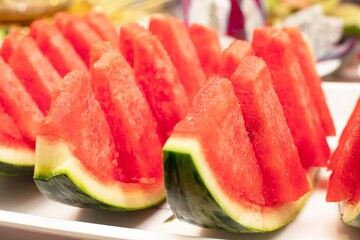 Watermelon slices ready to be served at the party. Healthy natural snack food concept
