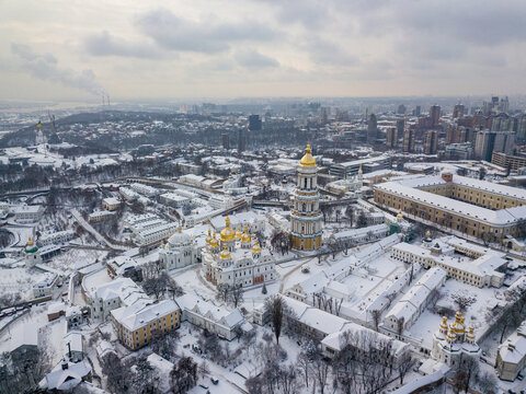 Kiev Pechersk Lavra, covered with snow. Cloudy winter morning. Aerial drone view.