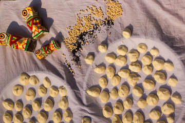 Bengali sun-dried dumplings or bori made of red lentil and black gram kept on white cloth for...