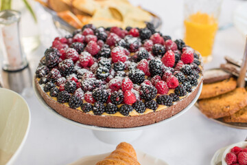 Delicious raspberry  tart (tartlet) with whipped cream. Breakfast Buffet Concept, Breakfast Time. Various brunch on the table