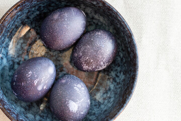 Blue easter eggs in a bowl. Top view