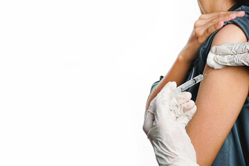 Doctor vaccinating male patient in clinic,COVID-19 vaccine in researcher hands, closeup
