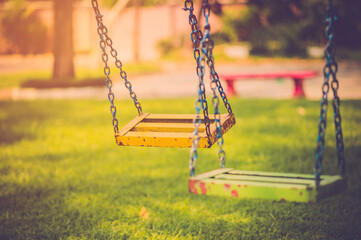 Empty chain swing in children playground