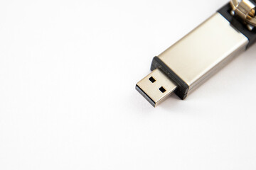Closeup shot of a gray USB stick on a white surface