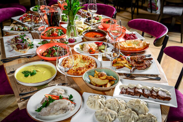 Georgian cuisine. A large laid table of different dishes