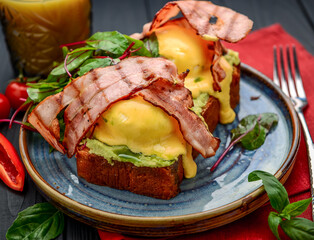 Eggs Benedict- toasted , bacon, poached eggs, and delicious buttery hollandaise sauce