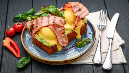 Eggs Benedict- toasted , bacon, poached eggs, and delicious buttery hollandaise sauce