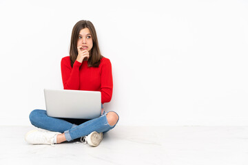 Tenaager girl working with pc isolated on white background nervous and scared