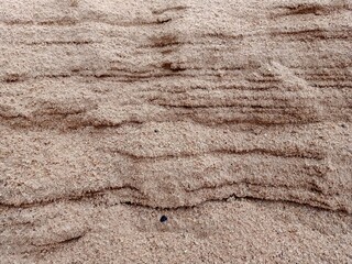 the texture of the sand wall.