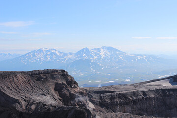Naklejka premium View from the top of Gorely volcano towards neighboring Mutnovsky volcano