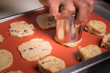Chef preparing cookies in his kitchen.
