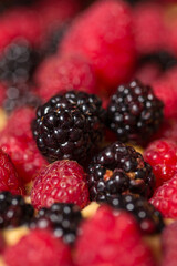 Chef cook preparing tart in his kitchen. Delicious raspberry  tart (tartlet) with whipped cream. Breakfast Buffet Concept, Breakfast Timeю. Various brunch on the table

