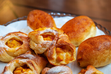 Apricot puff pastry and pies on a white napkin. Close-up, selective focus