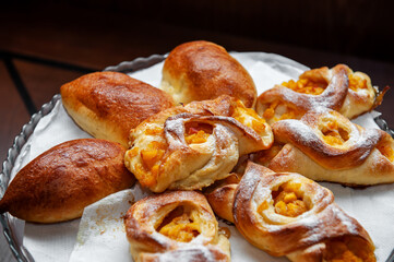 Apricot puff pastry and pies on a white napkin. Close-up, selective focus