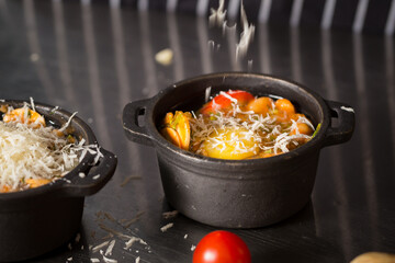 Chef cook preparing eggs  in his kitchen.Early meal with fried eggs served in pan. Breakfast Buffet Concept, Breakfast Timeю. Various brunch on the table