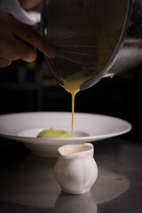 Chef cook preparing eggs  in his kitchen.Early meal with fried eggs served in pan. Breakfast Buffet Concept, Breakfast Timeю. Various brunch on the table