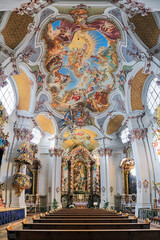 Fototapeta na wymiar Munich, Germany. Interior of abbey church of St. Anna im Lehel. The church was built in 1727-1733 by Johann Michael Fischer. Interior was completed in 1737 by Asam brothers and Johann Baptist Straub.