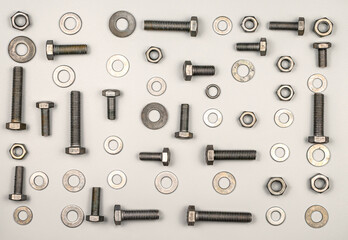 Texture of bolts, nuts, washers on a gray background