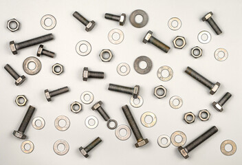 Texture of bolts, nuts, washers on a gray background