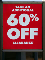 A store poster in a downtown area offering steep discounts because of slow business during the Covid-19 pandemic