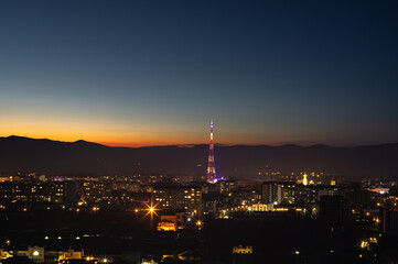 Fototapeta premium TV tower in the Ukrainian city before dawn