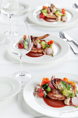 Steak on the bone. tomahawk steak On a white background. Top view. Free copy space.