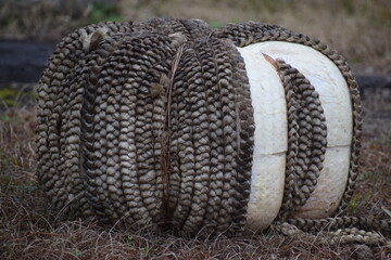 Rope buoy left on the bank near a waterway