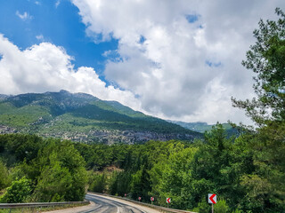 Which is one of Turkey's most beautiful sights highway between Olympos Antalya, sparkling and clear blue skies, magnificent nature and trees.