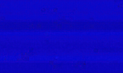 A blank blue texture from a digital display capture, full of glitches and noise artifacts.