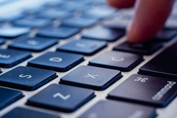 hands typing on a keyboard