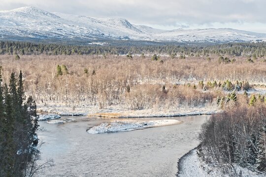 A winter view of the V&aring;l&aring;n River and the hill in V&aring;l&aring;dalen in northern Sweden