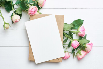Greeting card with fresh roses on white background, mockup with copy space