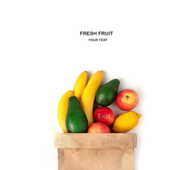 Craft bag with fruit on a white background. The concept of shopping, natural products.