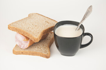sandwich with sausage on white background. Breakfast, fast food