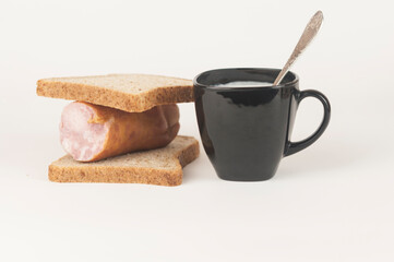sandwich with sausage on white background. Breakfast, fast food