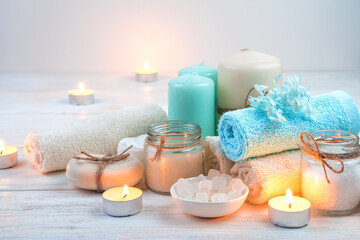 Fototapeta na wymiar Beautiful spa set with candles on a light background. The concept of relaxation, recovery.