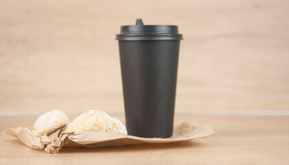 orange snowball cookies with coffee cup on wood table