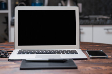 Image of the retoucher's workplace. Graphic tablet, laptop, stylus. Freelance concept. Creative...