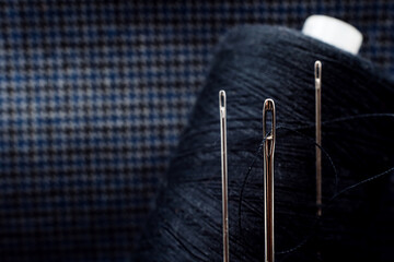 Needle and thread close-up. Macro. Items for the work of a tailor and seamstress. Crafts