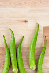 wood background with okras