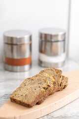 Healthy dark flour toast bread on the wooden board.