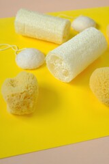 Zero waste. Natural organic hygiene products. loofah sponge and spongy konnyaku set on a bright yellow background.Reasonable consumption concept.Cleanliness and health