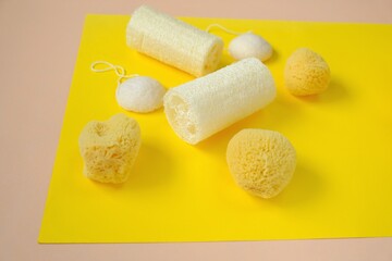  Zero waste concept. Natural organic hygiene products. loofah sponge and spongy konnyaku set   on a bright yellow background.Reasonable consumption .Cleanliness and health